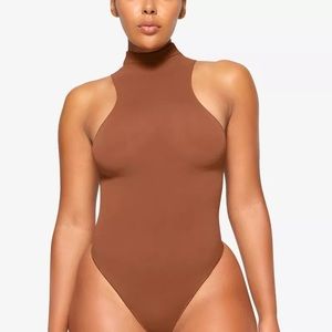 Skims Seamless Sculpt High Neck Thong Bodysuit in Bronze
